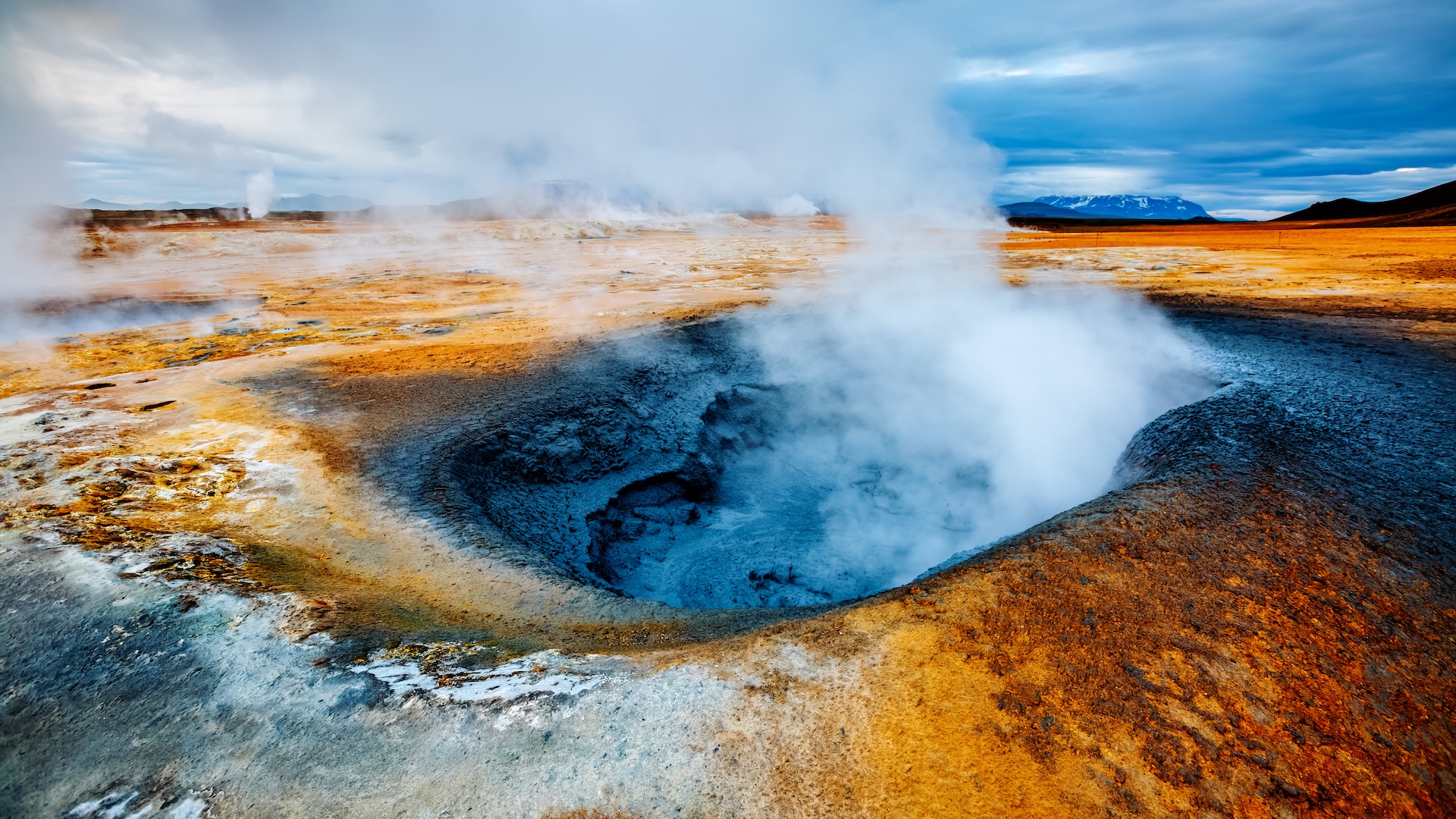a photo of steam coming from a geothermal vent