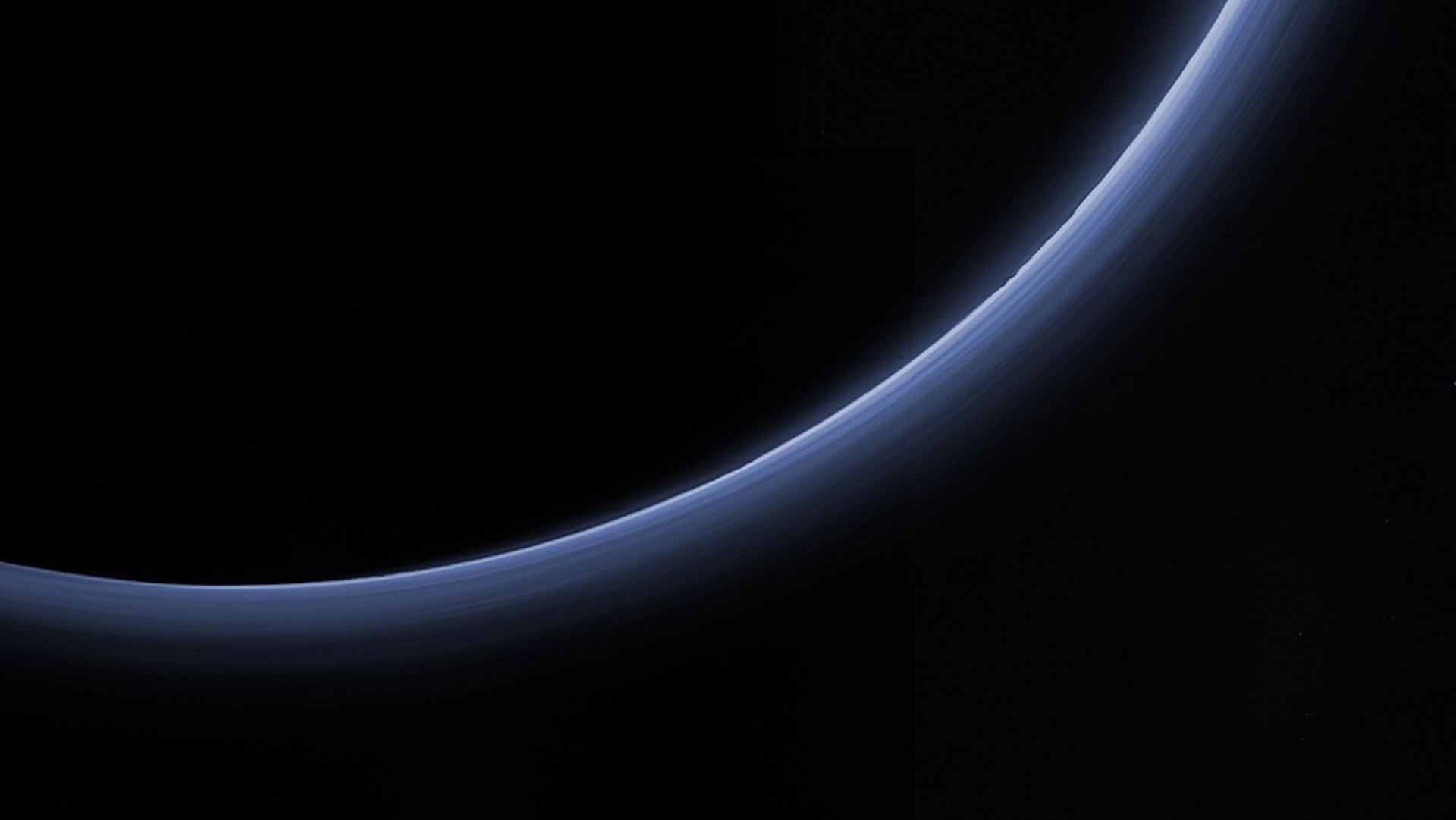 an image of the silhouette of Pluto glowing blue
