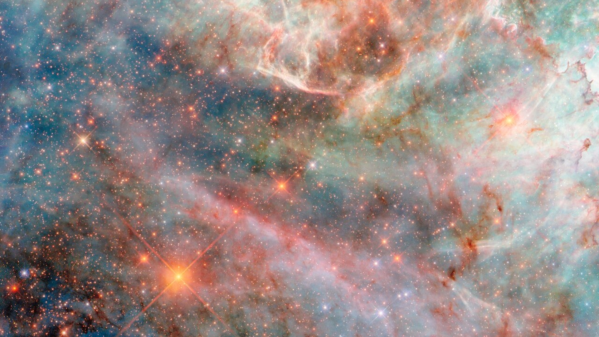 An image of the Large Magellanic Cloud with blue, purple, and pink hues