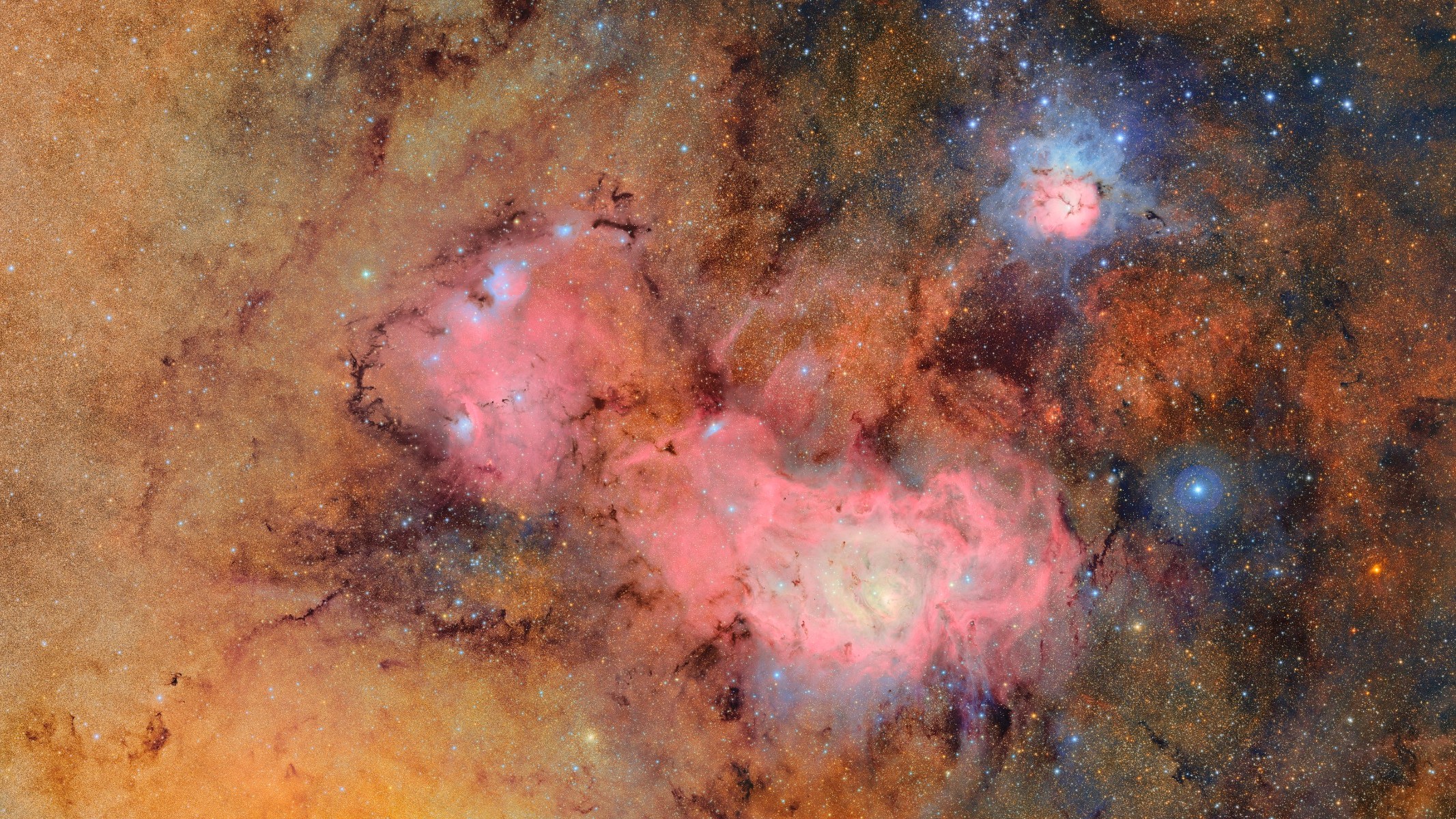 A space photograph of the Trifid and Lagoon nebulae taken with the Vera C. Rubin Observatory.