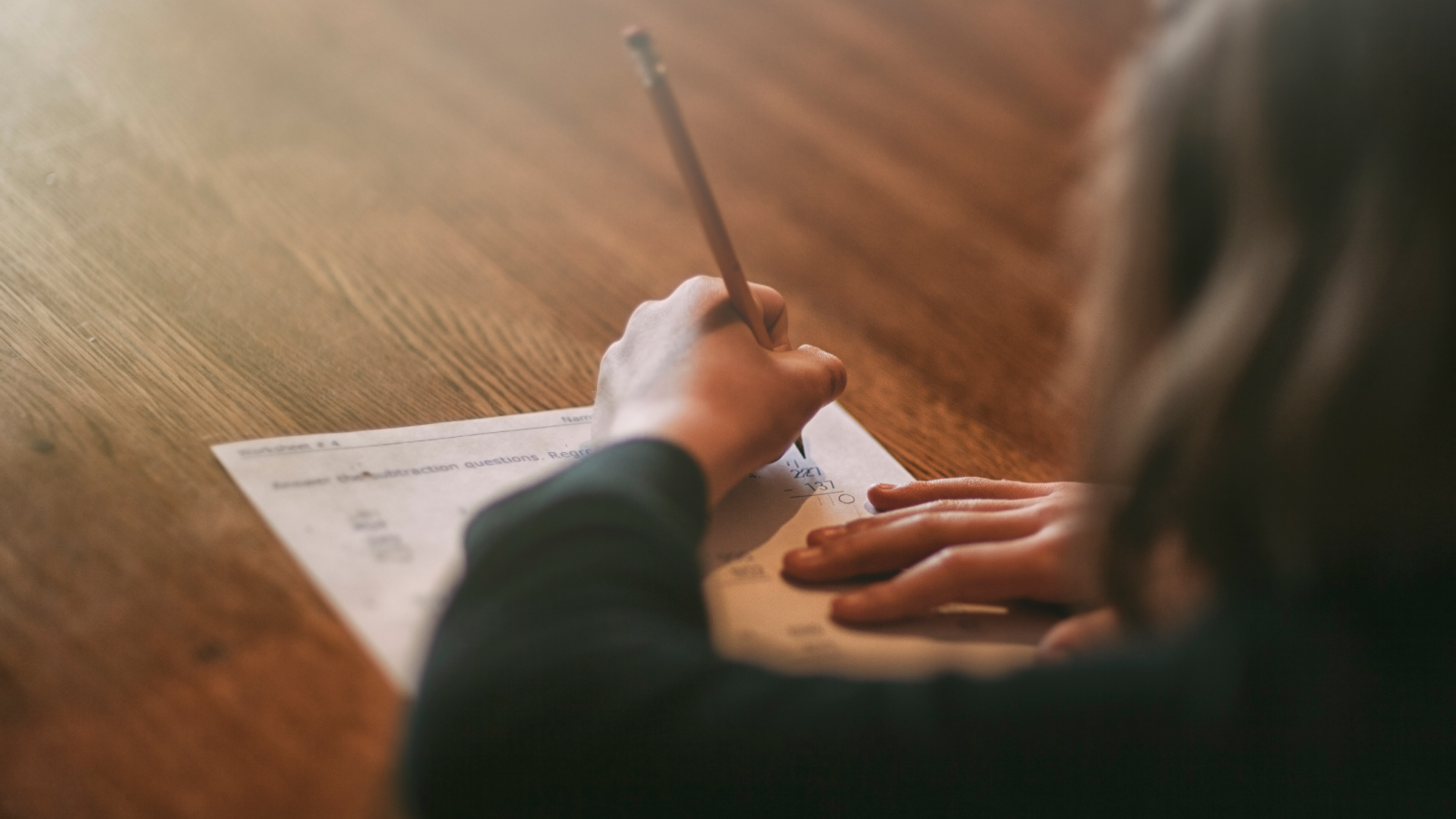 Girl doing math homework.
